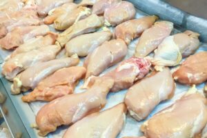 Frozen chicken package stored in a freezer